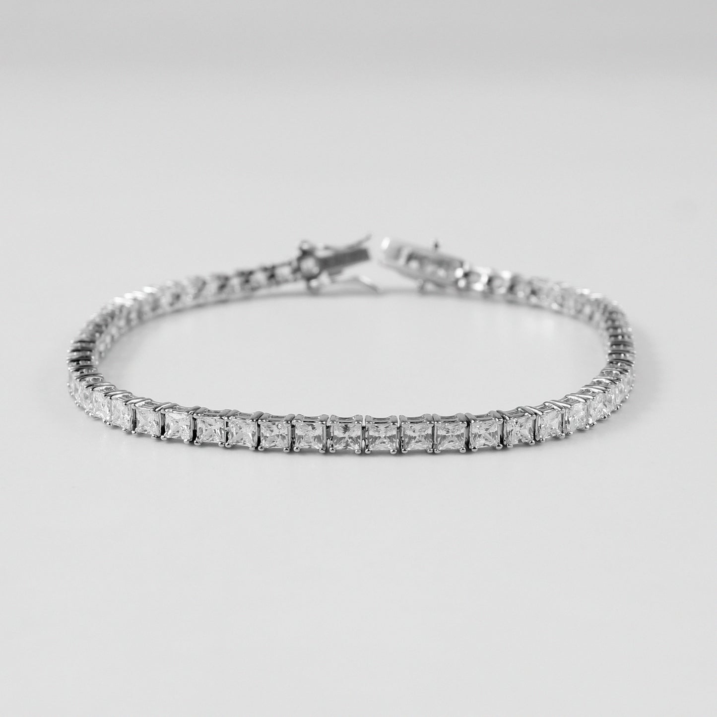 Tennis Bracelet - A classic 925 sterling silver bracelet by GetTheJuice, featuring a continuous row of sparkling stones that add timeless elegance and sophistication to any wrist.