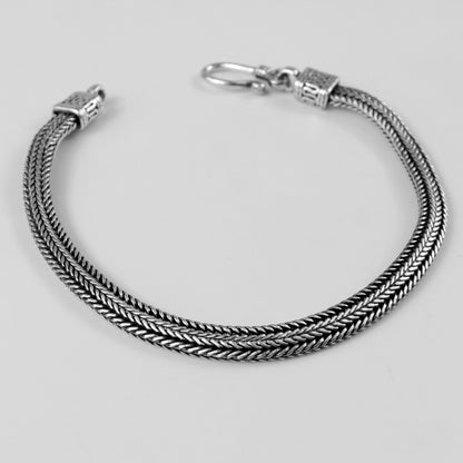 Wheat Weave Bracelet - A refined 925 sterling silver bracelet by GetTheJuice, featuring a delicate wheat weave pattern perfect for adding a touch of timeless charm.