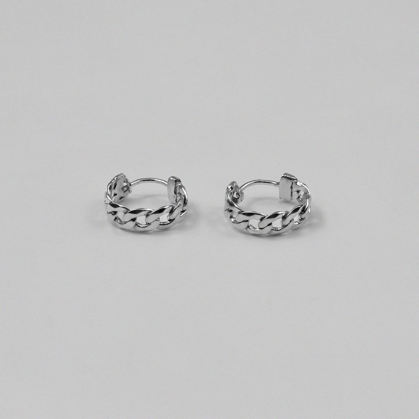 Cuban Earrings - An exquisite pair of 925 sterling silver ear ring by GetTheJuice, with a beautifully crafted Cuban link design that combines elegance and modern style, making them a versatile addition to any jewelry collection.