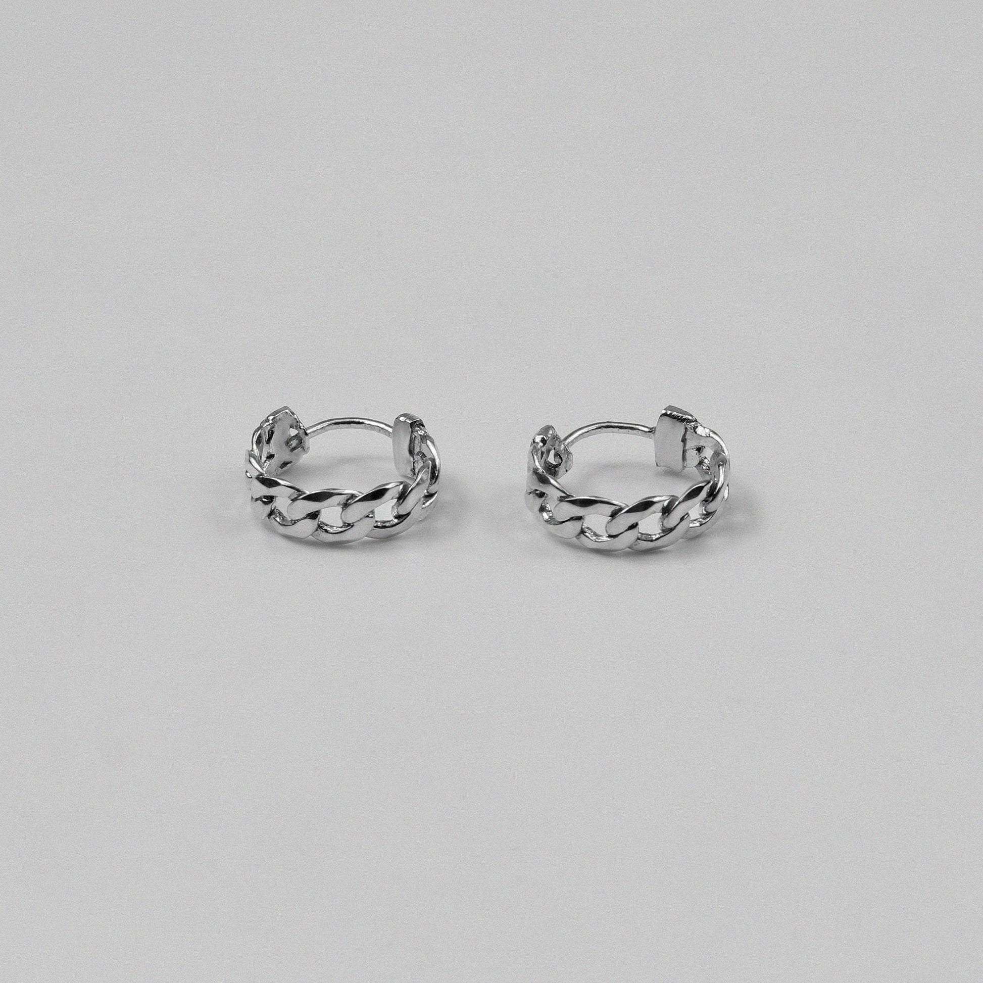 Cuban Earrings - An exquisite pair of 925 sterling silver ear ring by GetTheJuice, with a beautifully crafted Cuban link design that combines elegance and modern style, making them a versatile addition to any jewelry collection.