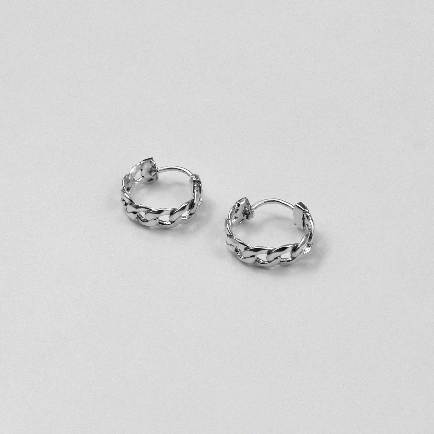 Cuban Earrings - An exquisite pair of 925 sterling silver ear ring by GetTheJuice, with a beautifully crafted Cuban link design that combines elegance and modern style, making them a versatile addition to any jewelry collection.