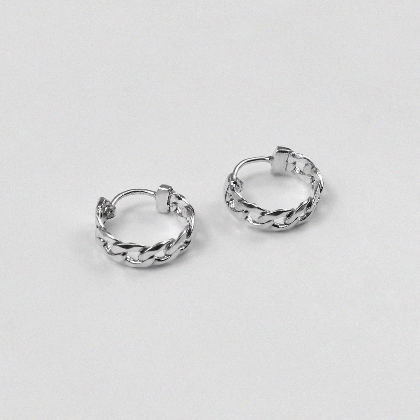 Cuban Earrings - An exquisite pair of 925 sterling silver ear ring by GetTheJuice, with a beautifully crafted Cuban link design that combines elegance and modern style, making them a versatile addition to any jewelry collection.