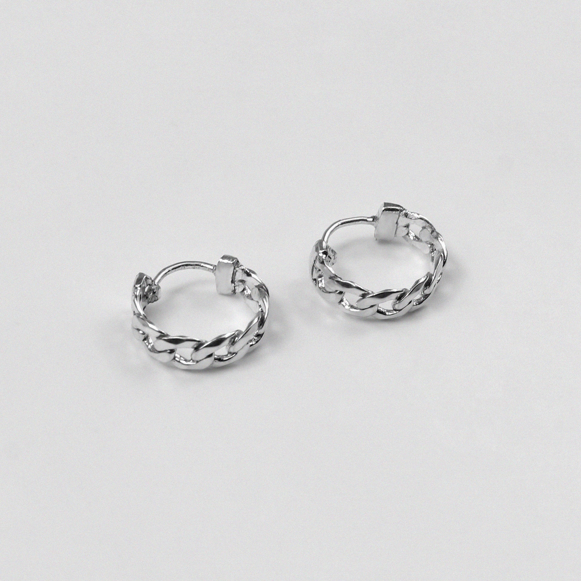 Cuban Earrings - An exquisite pair of 925 sterling silver ear ring by GetTheJuice, with a beautifully crafted Cuban link design that combines elegance and modern style, making them a versatile addition to any jewelry collection.