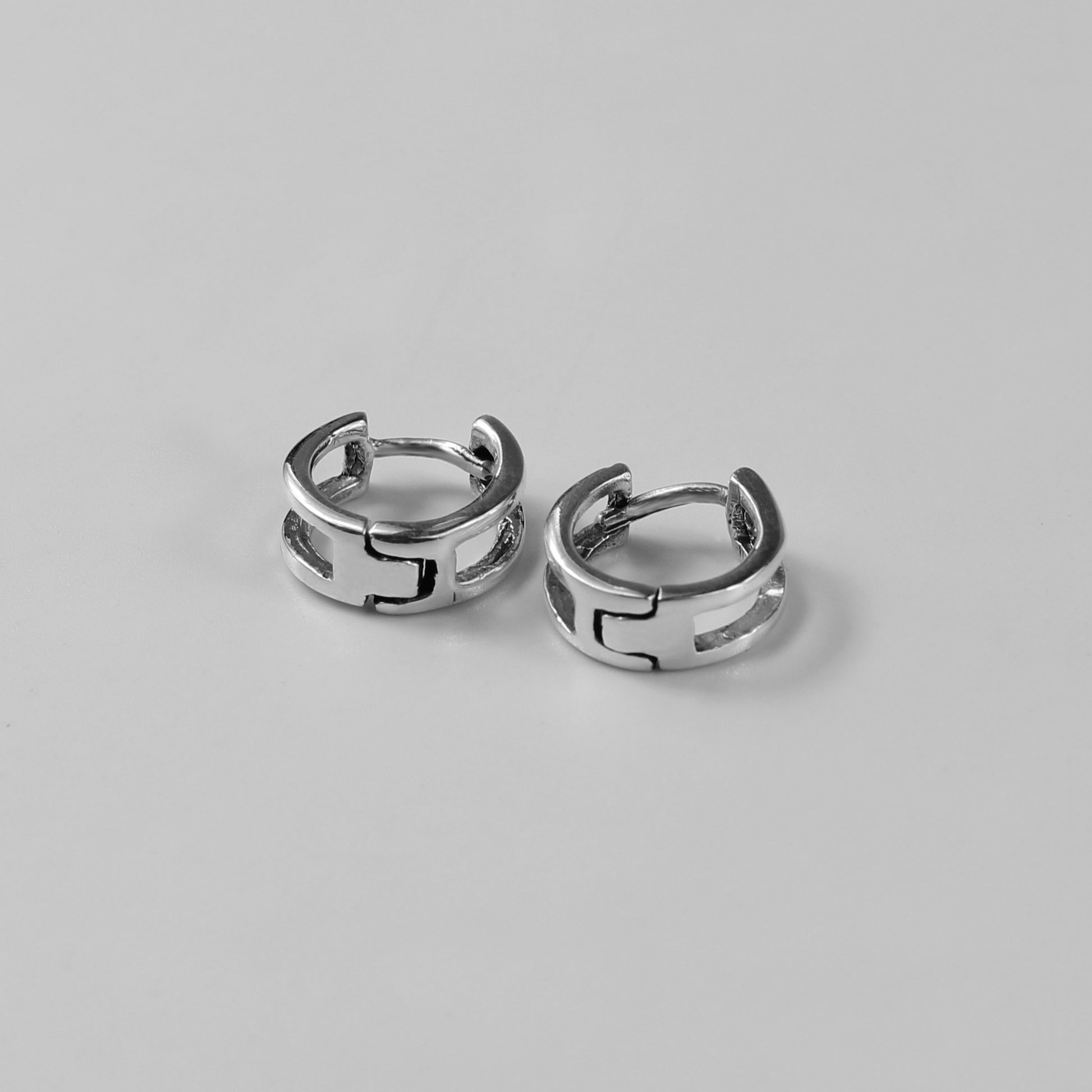 Eclipse Edge Earrings - A stunning pair of 925 sterling silver earrings by GetTheJuice, showcasing a bold design reminiscent of an eclipse, perfect for adding a statement of elegance and mystery to your look.