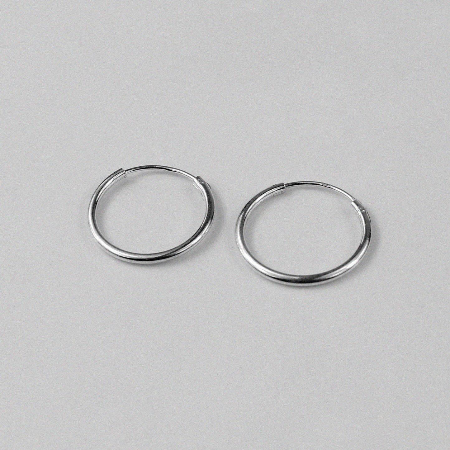 Radiant Halo Earrings - An exquisite pair of 925 sterling silver earrings by GetTheJuice, with a captivating halo design that exudes a sense of ethereal beauty and grace, making them a brilliant addition to any jewelry collection.