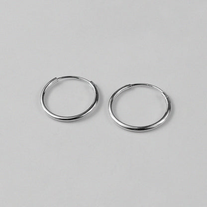 Radiant Halo Earrings - An exquisite pair of 925 sterling silver earrings by GetTheJuice, with a captivating halo design that exudes a sense of ethereal beauty and grace, making them a brilliant addition to any jewelry collection.