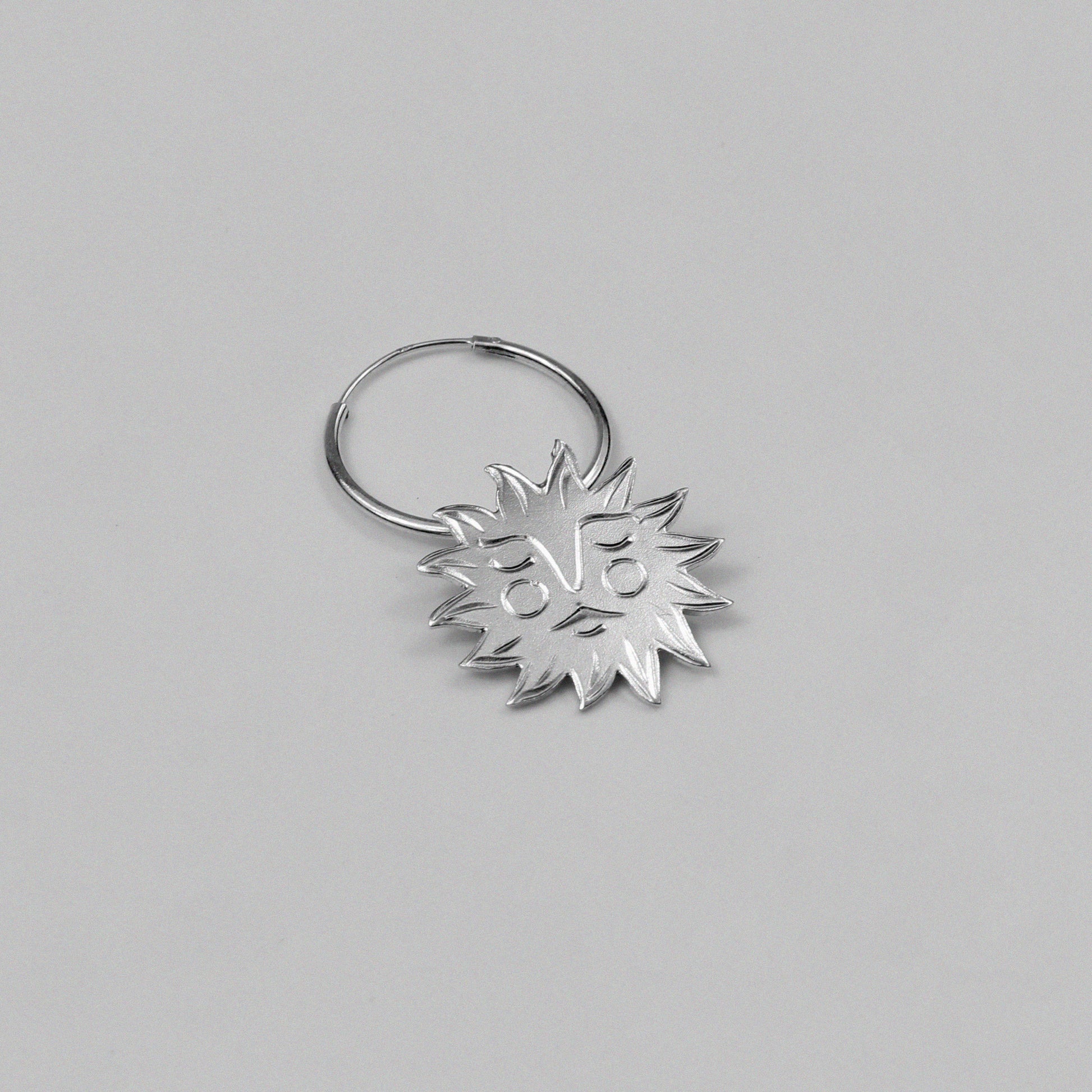 Soleil Earrings - An exquisite pair of 925 sterling silver earrings by GetTheJuice, with a beautiful sun design that captures the warmth and brilliance of the sun, enhancing any outfit with a touch of radiant charm.