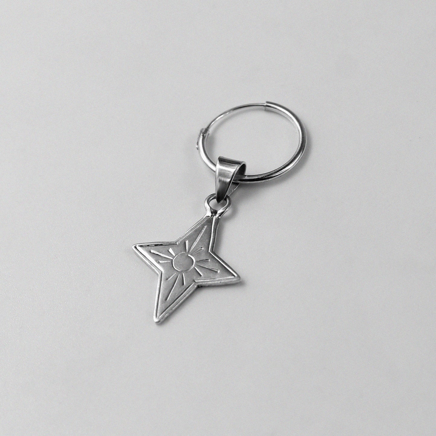 Y2K Star Earrings - An elegant pair of 925 sterling silver earrings by GetTheJuice, featuring a star design inspired by the nostalgic Y2K era, adding a touch of retro-futuristic charm to any look.