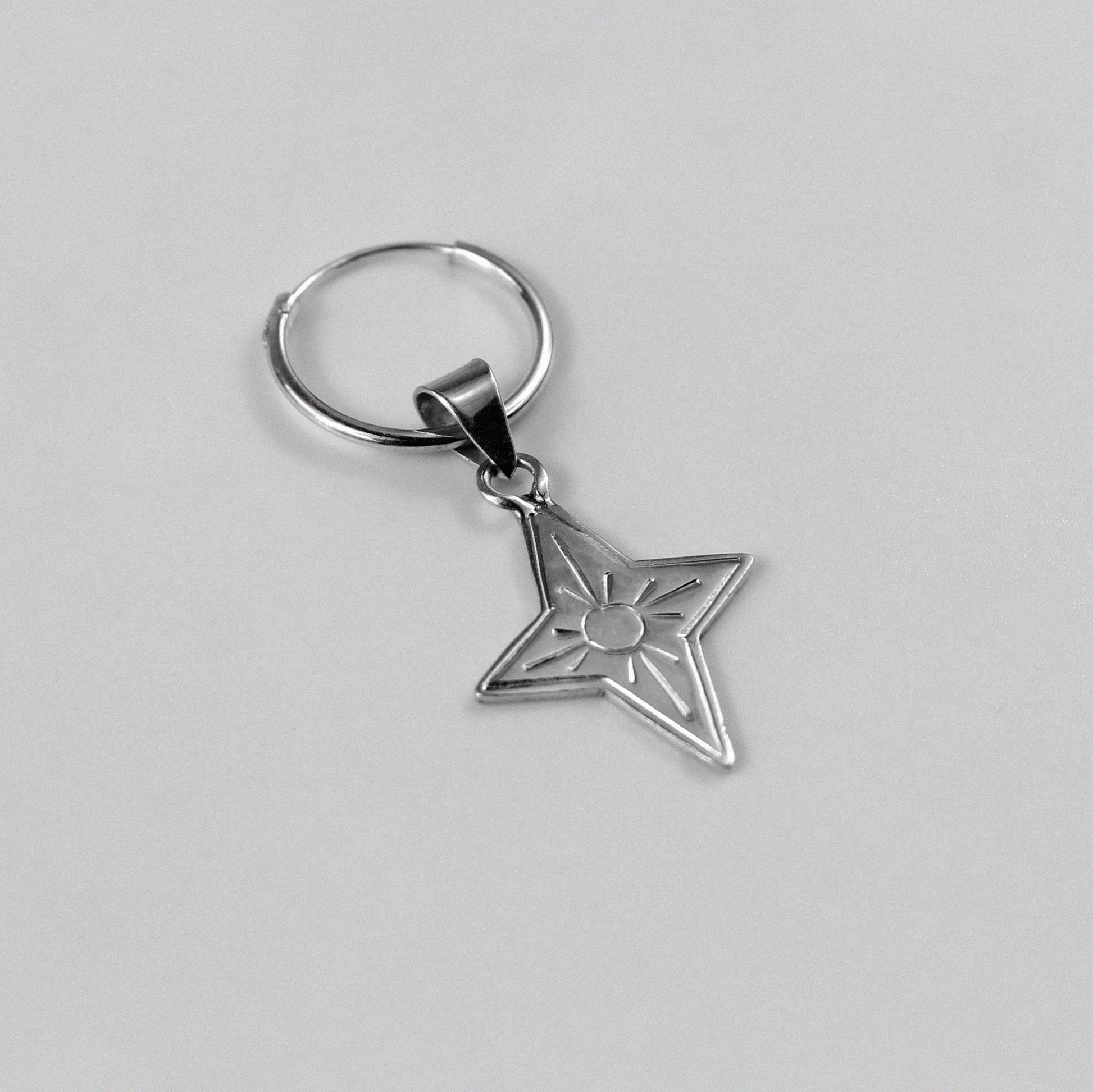 Y2K Star Earrings - An elegant pair of 925 sterling silver earrings by GetTheJuice, featuring a star design inspired by the nostalgic Y2K era, adding a touch of retro-futuristic charm to any look.