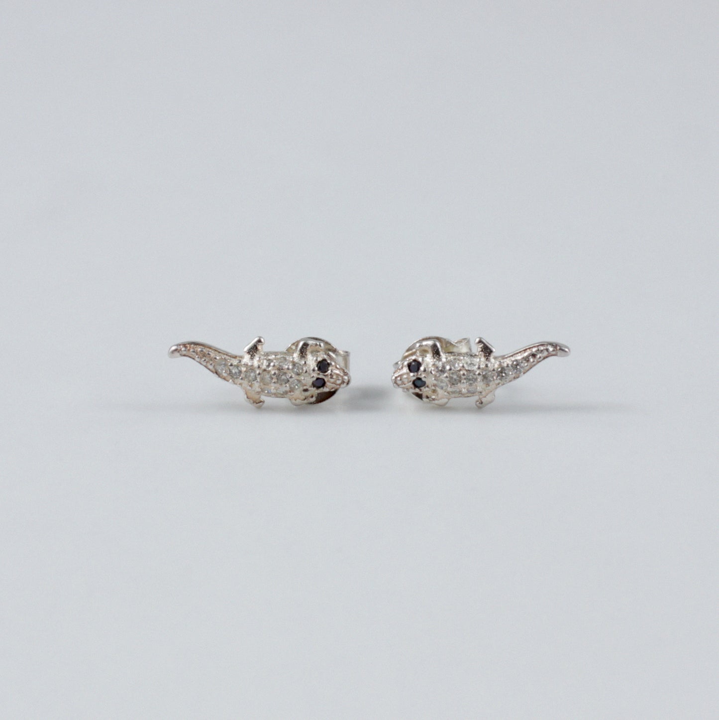 Crocodile Luxe Ear Studs - An exquisite pair of 925 sterling silver ear studs by GetTheJuice, with a refined crocodile design that combines luxury and a hint of the exotic, enhancing any ensemble with a touch of distinction.