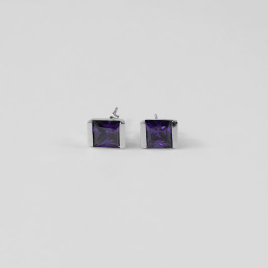 Violet Gleam Ear Studs - A stunning pair of 925 sterling silver ear studs by GetTheJuice, showcasing a sparkling violet hue that enhances any ensemble with a pop of vibrant elegance.