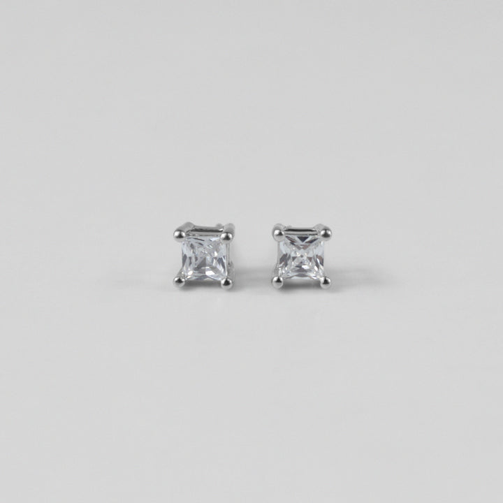 Whimsical White Ear Studs - A stunning pair of 925 sterling silver ear studs by GetTheJuice, showcasing a playful white motif that enhances any ensemble with a hint of lighthearted elegance.