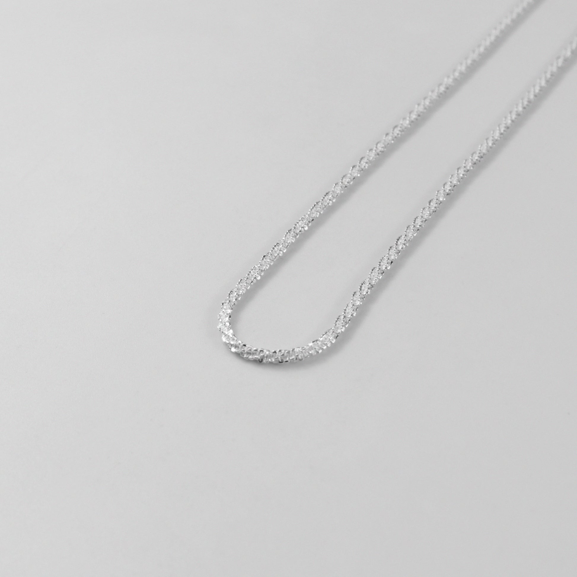 Chic Tightrope Necklace - A stylish 925 sterling silver necklace by GetTheJuice, featuring a sleek and elegant design that adds a touch of sophistication to any outfit.