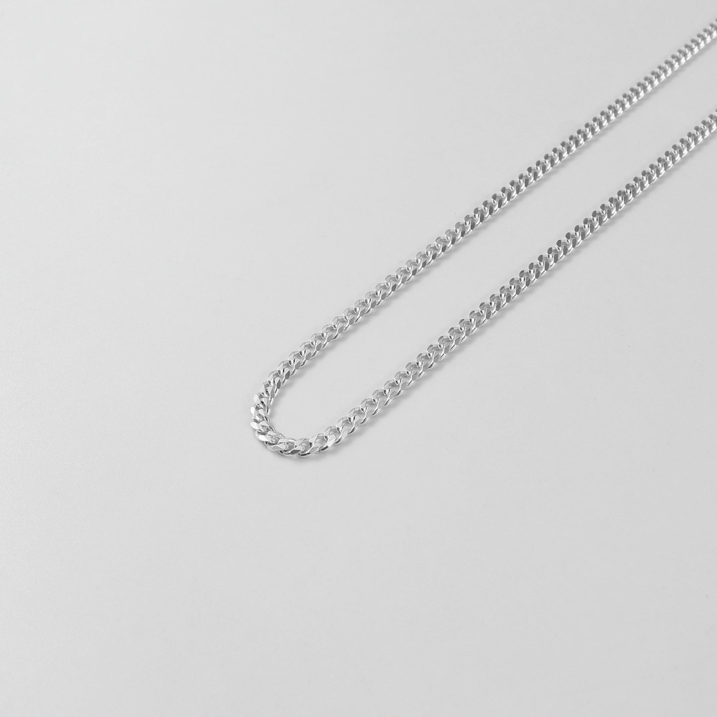 Cuban Necklace - A timeless 925 sterling silver necklace by GetTheJuice, featuring a bold and intricate Cuban link design that adds a touch of sophistication to any outfit.