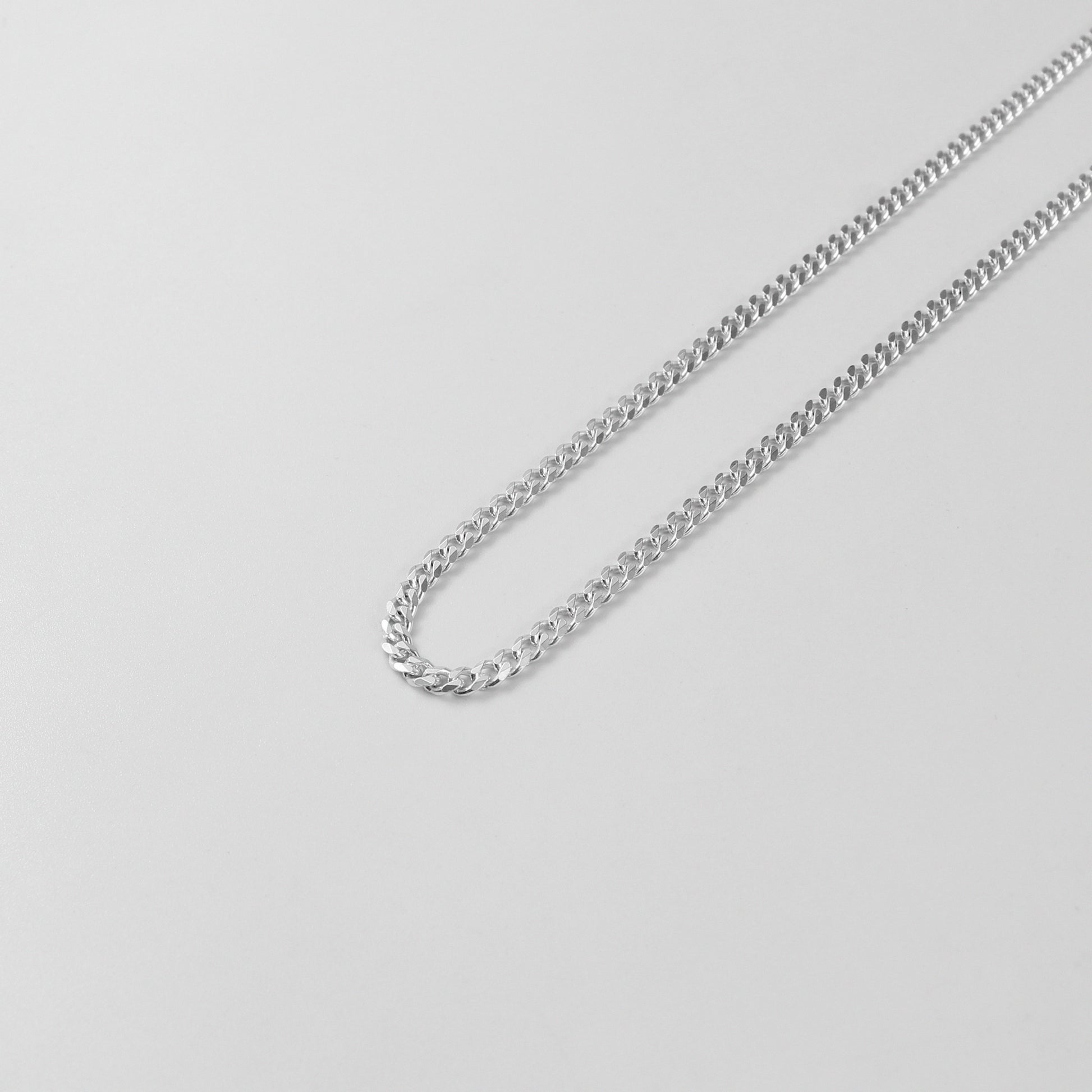 Cuban Necklace - A timeless 925 sterling silver necklace by GetTheJuice, featuring a bold and intricate Cuban link design that adds a touch of sophistication to any outfit.