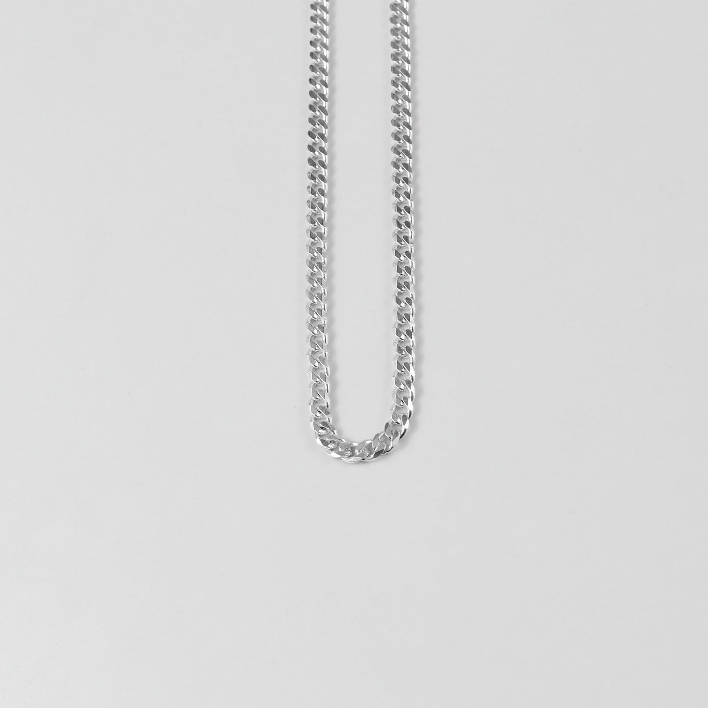 Cuban Necklace - A timeless 925 sterling silver necklace by GetTheJuice, featuring a bold and intricate Cuban link design that adds a touch of sophistication to any outfit.