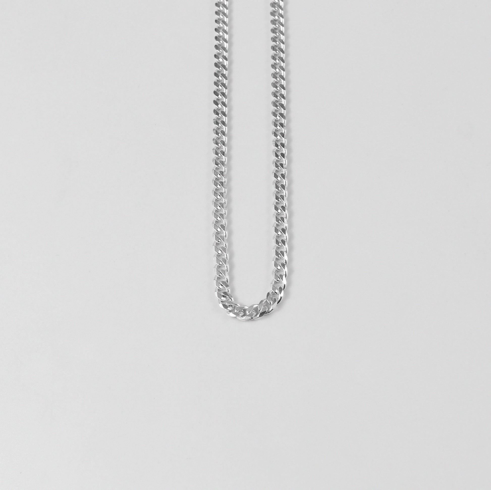 Cuban Necklace - A timeless 925 sterling silver necklace by GetTheJuice, featuring a bold and intricate Cuban link design that adds a touch of sophistication to any outfit.