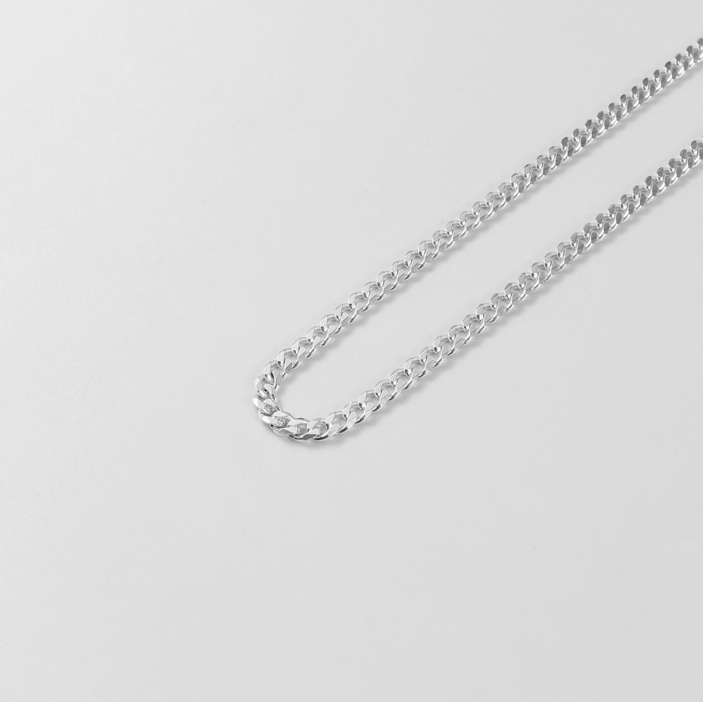 Cuban Necklace - A timeless 925 sterling silver necklace by GetTheJuice, featuring a bold and intricate Cuban link design that adds a touch of sophistication to any outfit.