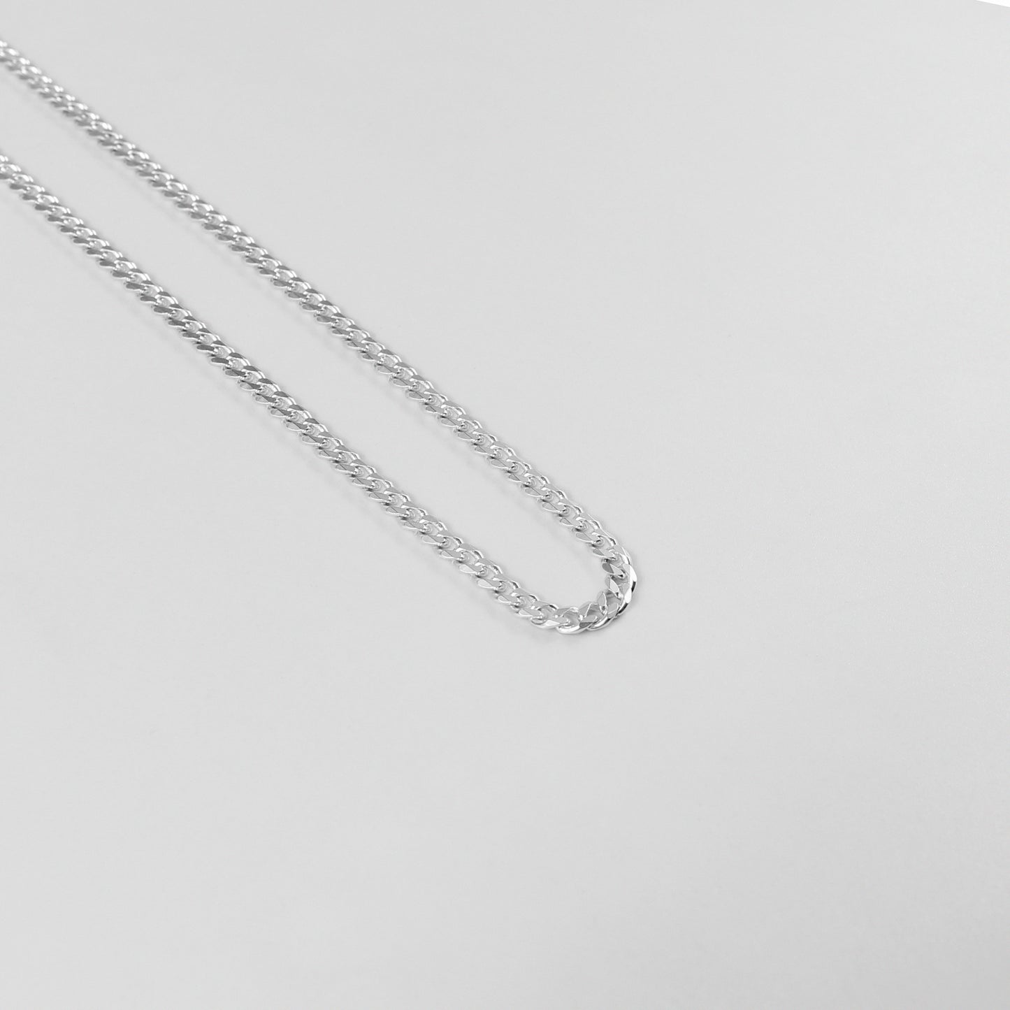 Cuban Necklace - A timeless 925 sterling silver necklace by GetTheJuice, featuring a bold and intricate Cuban link design that adds a touch of sophistication to any outfit.