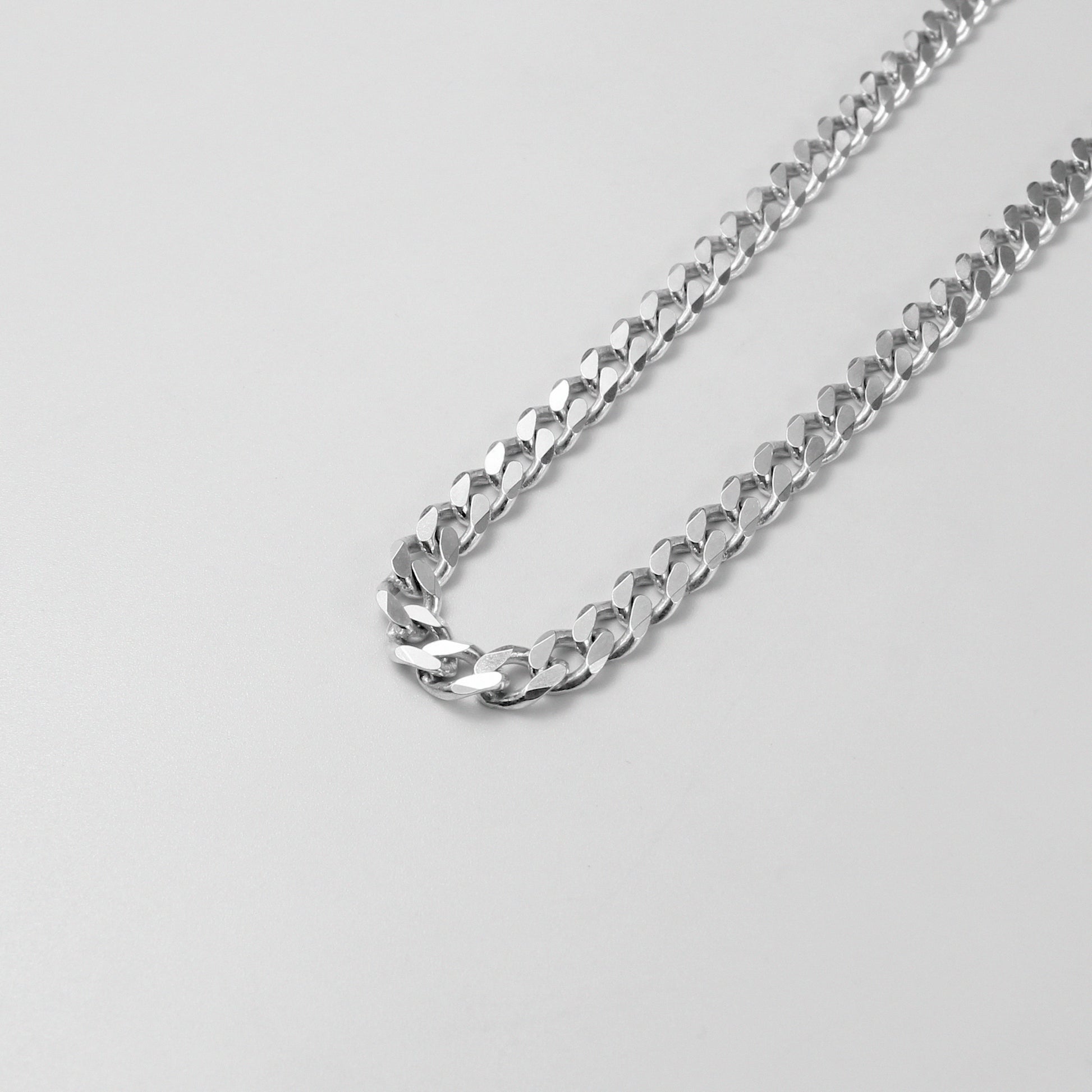 Cuban Necklace - A timeless 925 sterling silver necklace by GetTheJuice, featuring a bold and intricate Cuban link design that adds a touch of sophistication to any outfit.