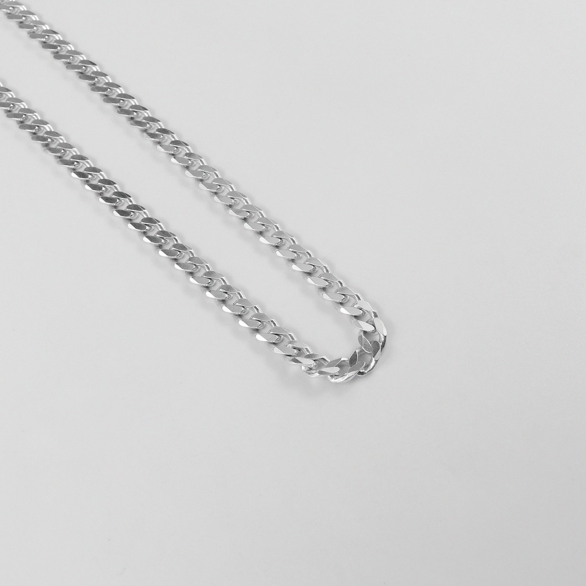 Cuban Necklace - A timeless 925 sterling silver necklace by GetTheJuice, featuring a bold and intricate Cuban link design that adds a touch of sophistication to any outfit.