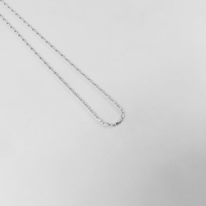 925 sterling silver necklace named 'Ethereal Silver Bead,' featuring a delicate strand of luminous silver beads that exude elegance and simplicity. Its refined design captures an otherworldly charm, making it a versatile accessory for both casual and formal occasions.