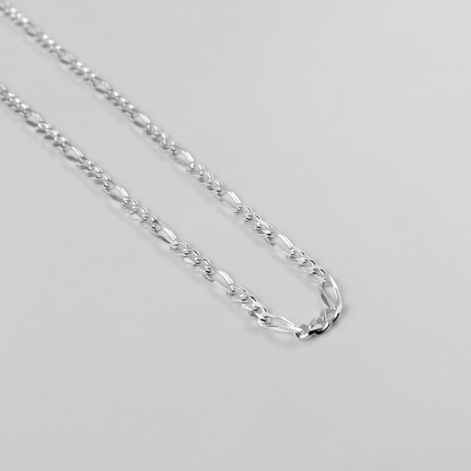 Figaro Necklace - A classic 925 sterling silver necklace by GetTheJuice, featuring the timeless Figaro link design that adds a touch of elegance and sophistication to any outfit.