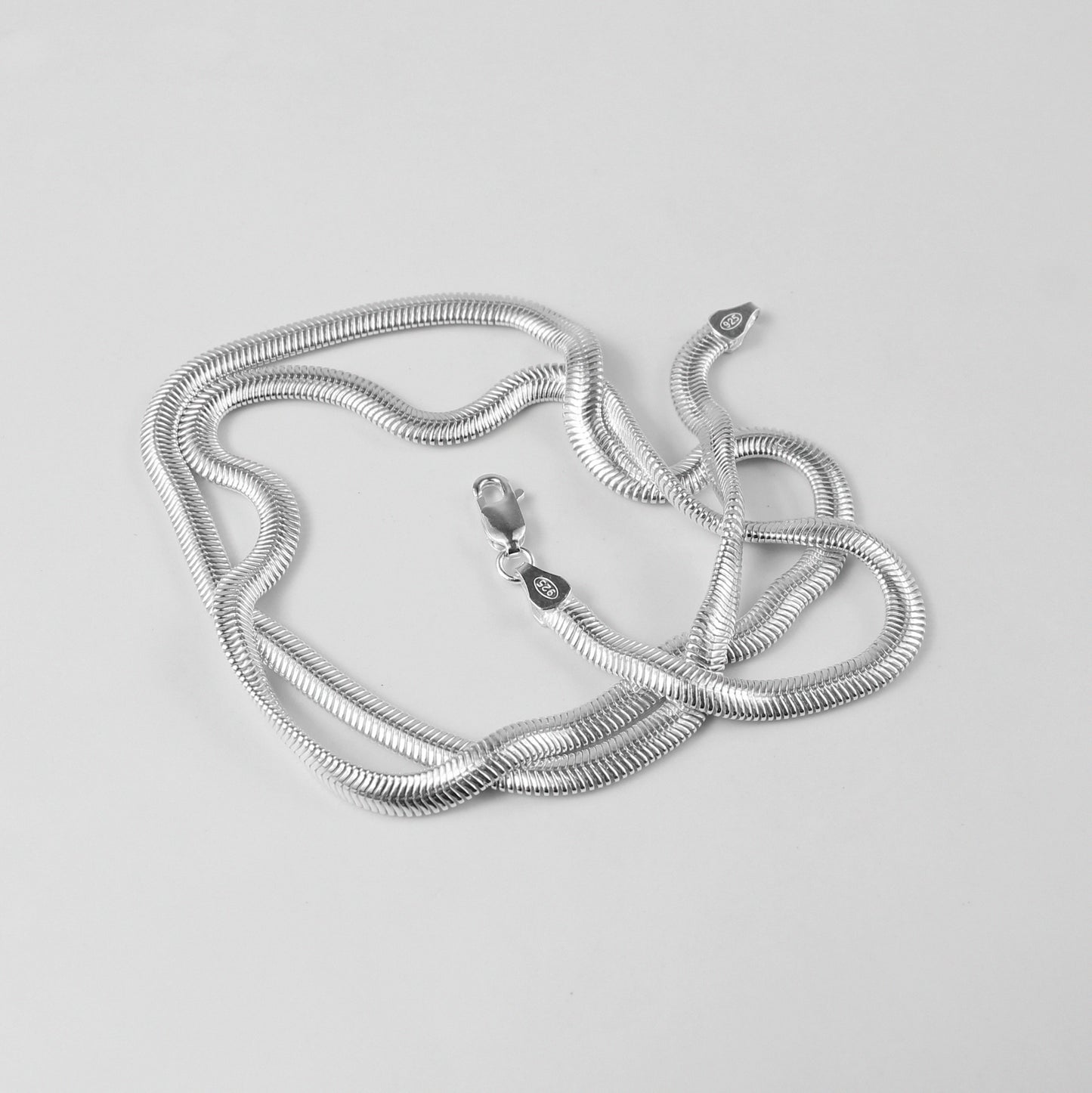 Flat Snake Necklace - A sophisticated 925 sterling silver necklace by GetTheJuice, featuring a sleek flat snake chain design that offers a refined and elegant touch to any ensemble.