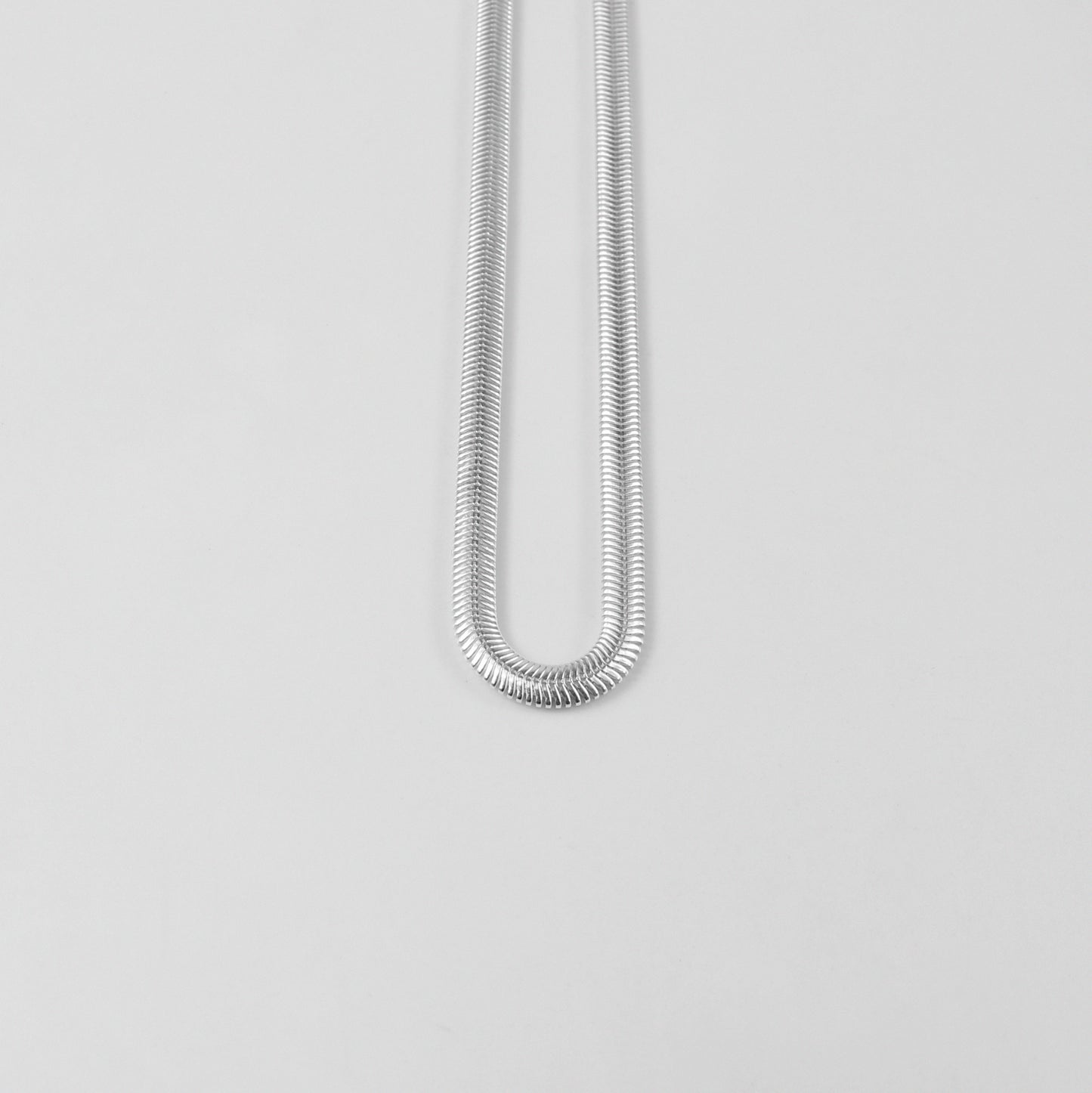 Flat Snake Necklace - A sophisticated 925 sterling silver necklace by GetTheJuice, featuring a sleek flat snake chain design that offers a refined and elegant touch to any ensemble.