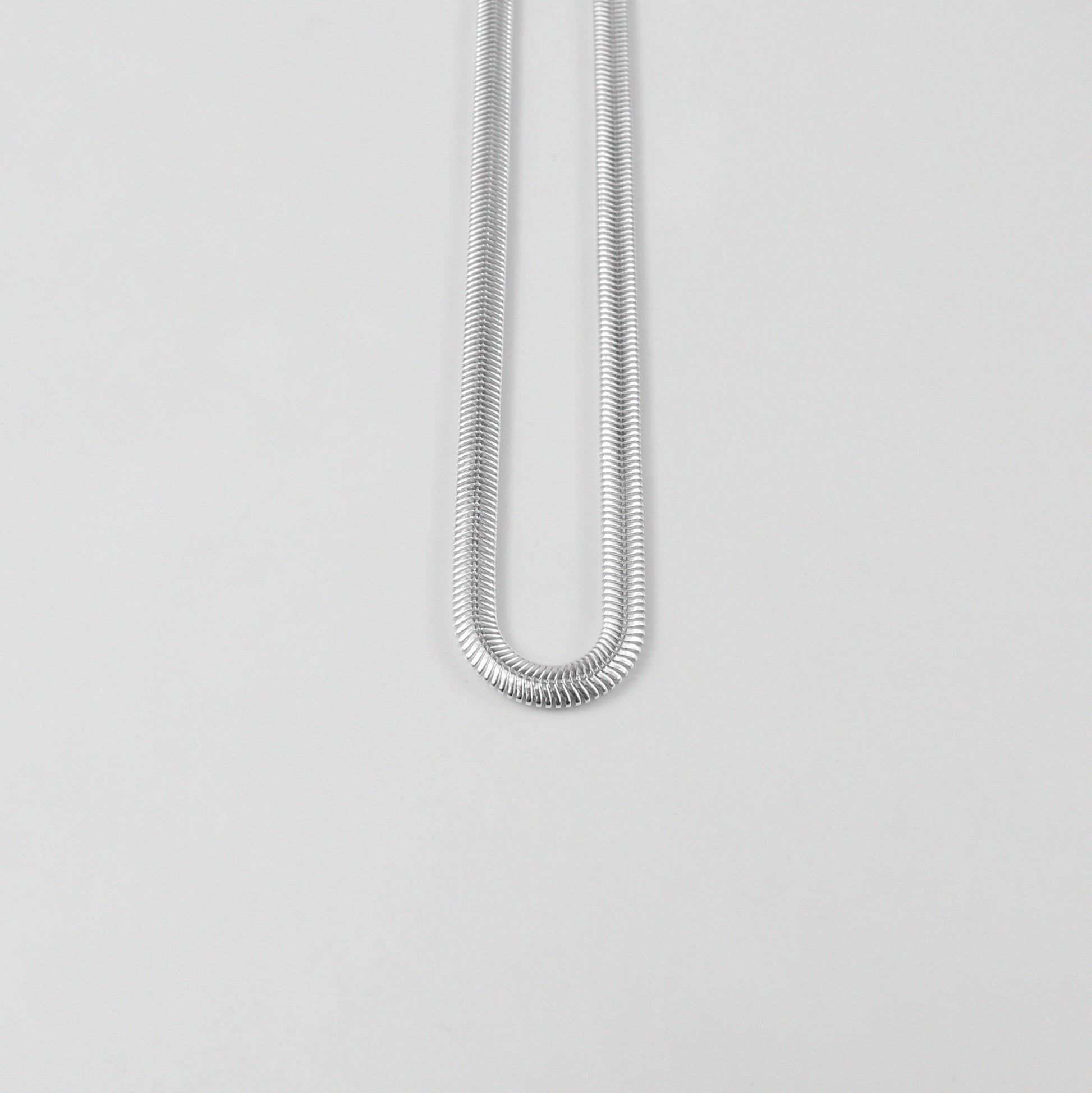 Flat Snake Necklace - A sophisticated 925 sterling silver necklace by GetTheJuice, featuring a sleek flat snake chain design that offers a refined and elegant touch to any ensemble.