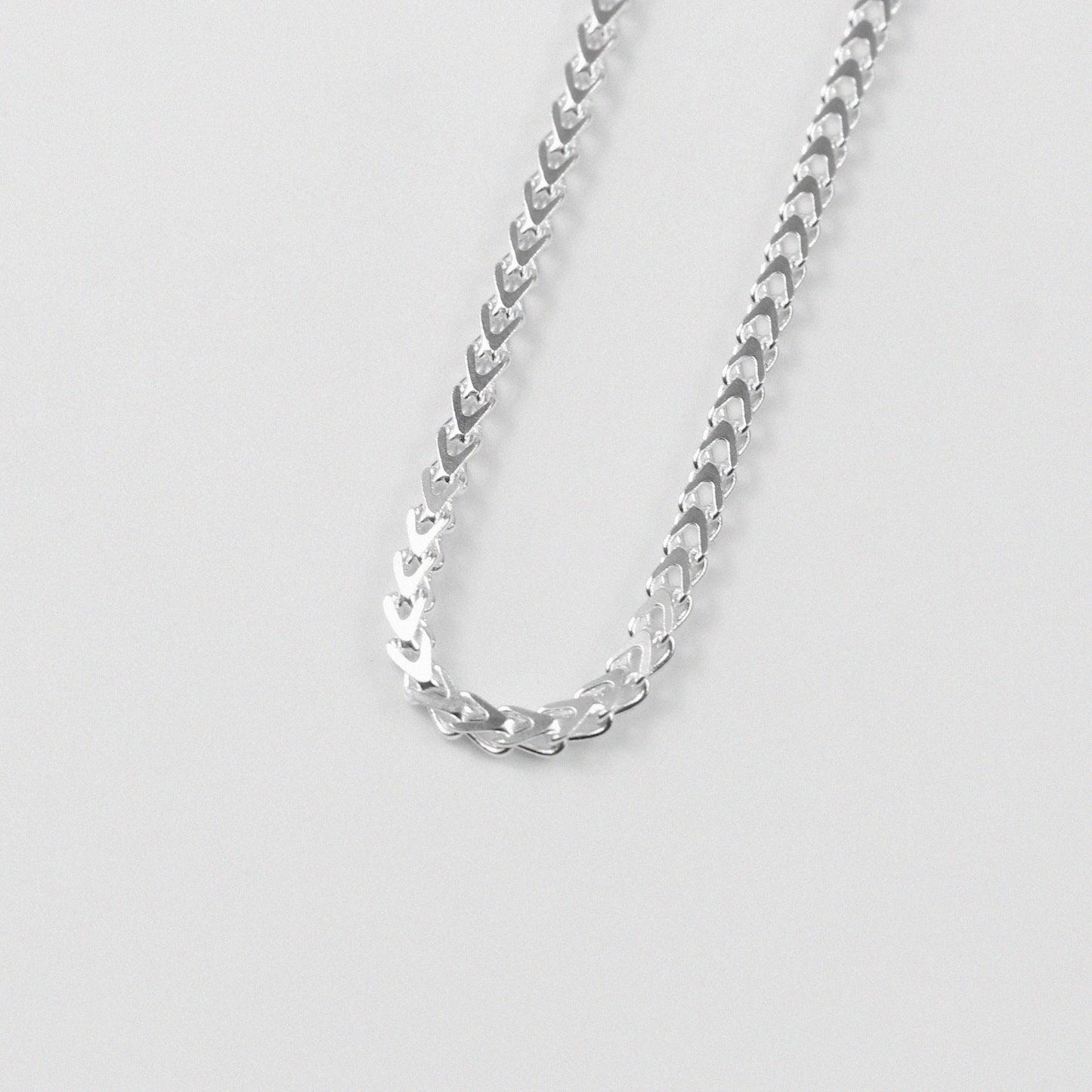 Hollow Braided Necklace - A sophisticated 925 sterling silver necklace by GetTheJuice, featuring a hollow braided design that combines lightweight comfort with elegant style.