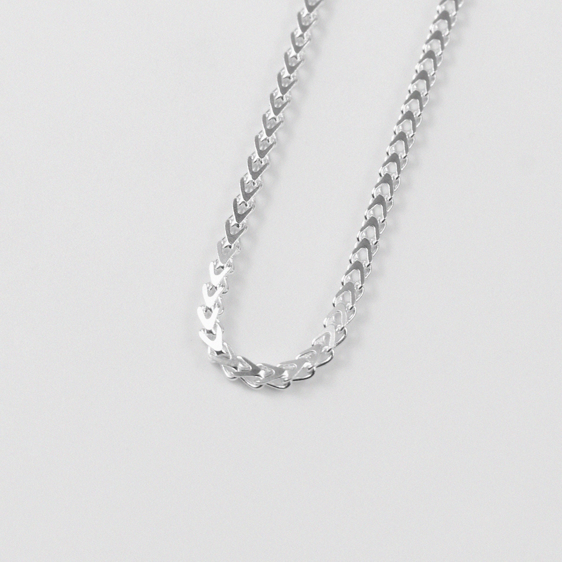 Hollow Braided Necklace - A sophisticated 925 sterling silver necklace by GetTheJuice, featuring a hollow braided design that combines lightweight comfort with elegant style.