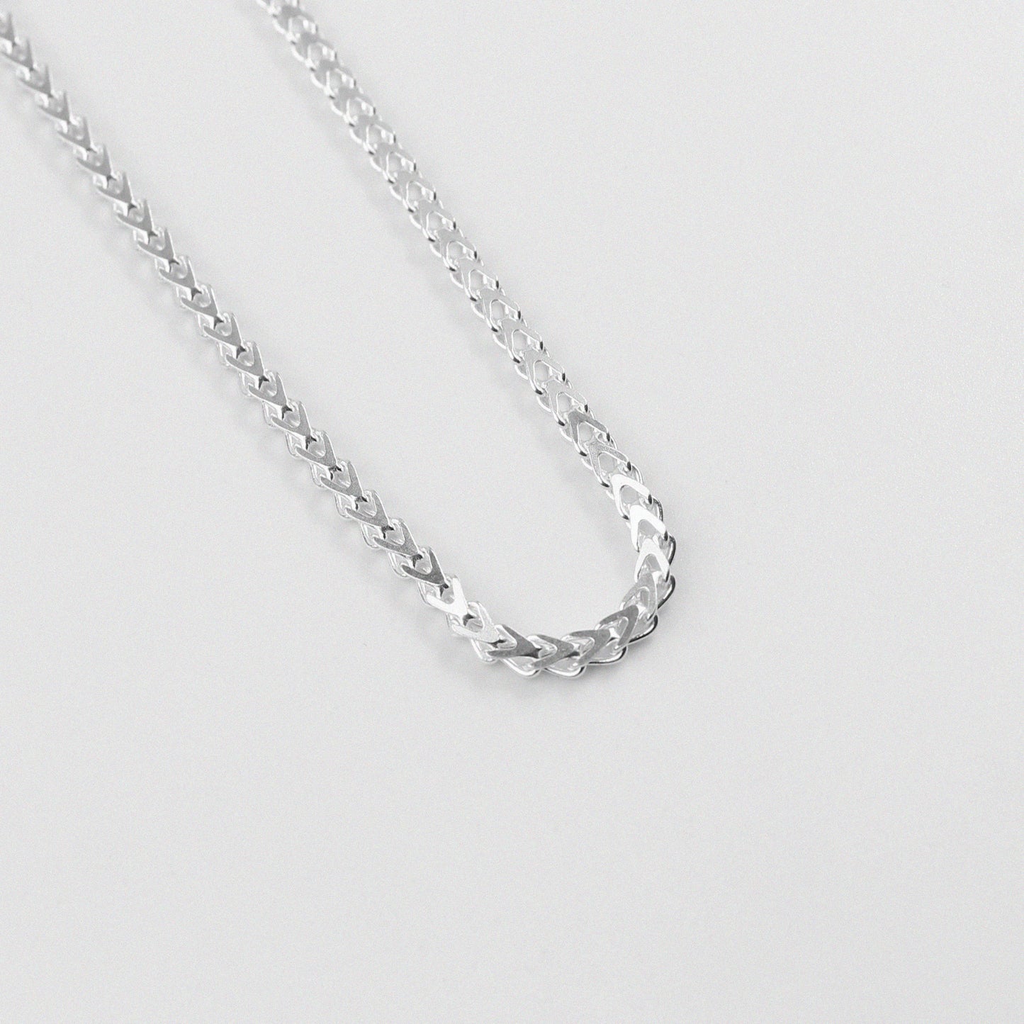 Hollow Braided Necklace - A sophisticated 925 sterling silver necklace by GetTheJuice, featuring a hollow braided design that combines lightweight comfort with elegant style.