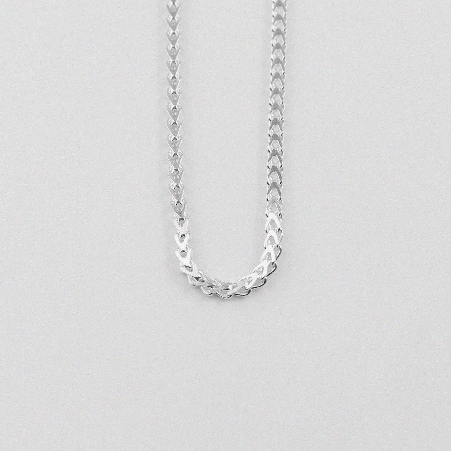 Hollow Braided Necklace - A sophisticated 925 sterling silver necklace by GetTheJuice, featuring a hollow braided design that combines lightweight comfort with elegant style.