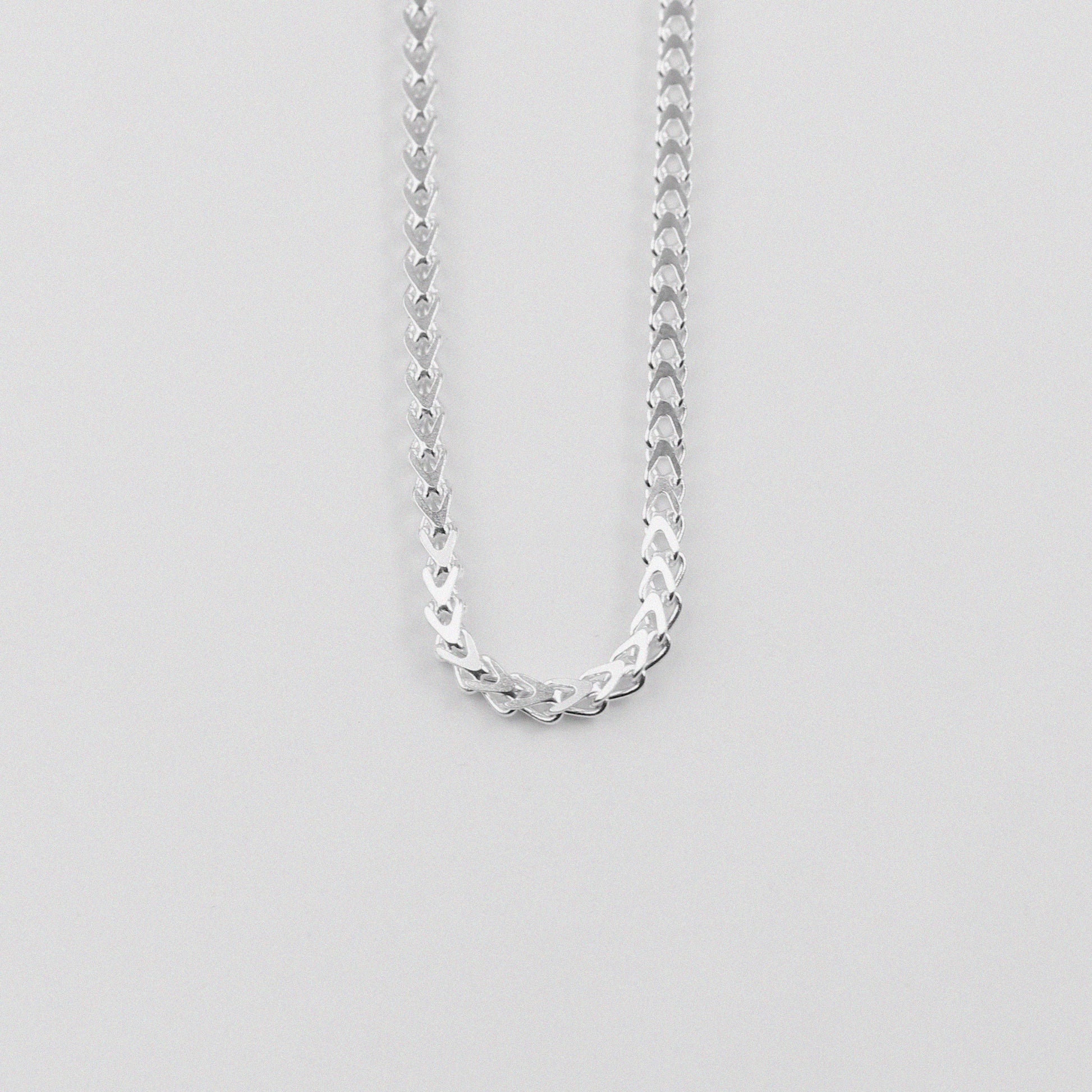 Hollow Braided Necklace - A sophisticated 925 sterling silver necklace by GetTheJuice, featuring a hollow braided design that combines lightweight comfort with elegant style.