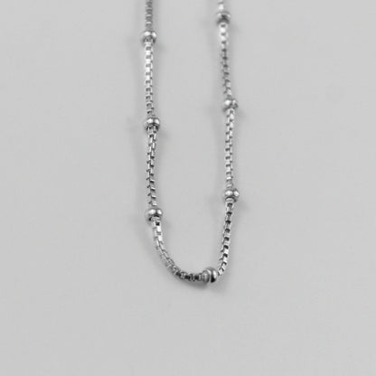 Rice Bead Satellite Necklace - An exquisite 925 sterling silver necklace by GetTheJuice, featuring delicate rice bead stations that add an elegant and contemporary flair to any ensemble.