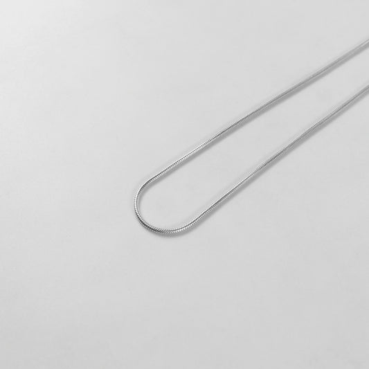 Round Snake Necklace - A refined 925 sterling silver necklace by GetTheJuice, showcasing a smooth and seamless round snake chain design that enhances any outfit with modern sophistication.
