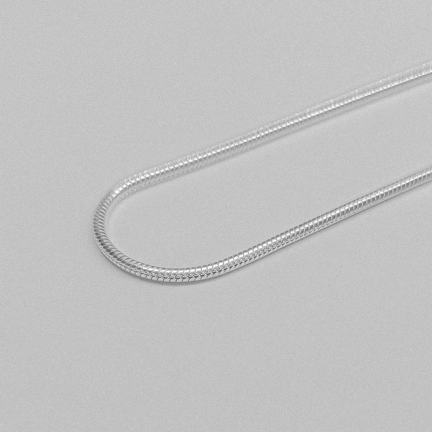 Round Snake Necklace - A refined 925 sterling silver necklace by GetTheJuice, showcasing a smooth and seamless round snake chain design that enhances any outfit with modern sophistication.