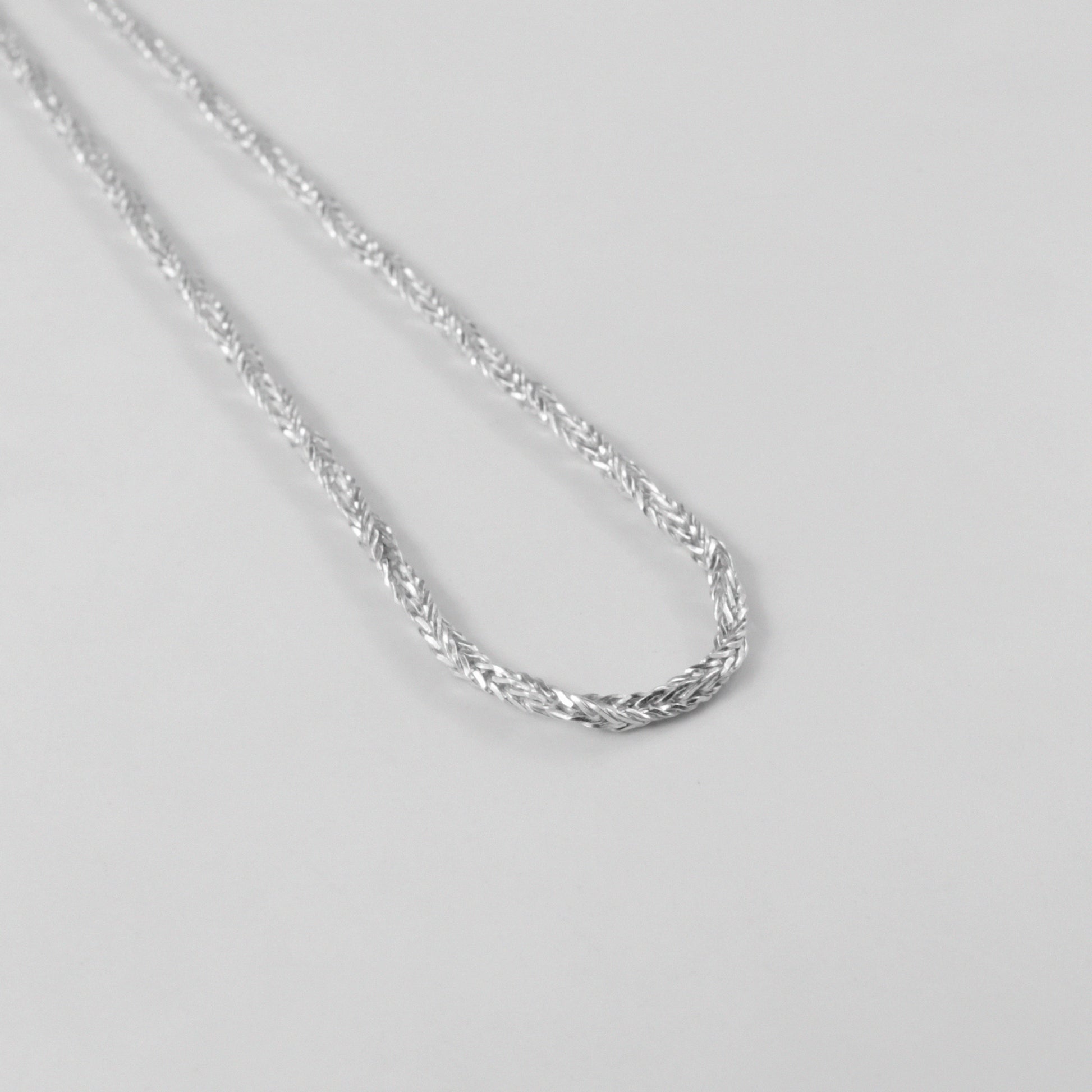 Starlit Weave Necklace - An elegant 925 sterling silver necklace by GetTheJuice, showcasing a delicate starlit weave pattern that brings a celestial charm to your ensemble.