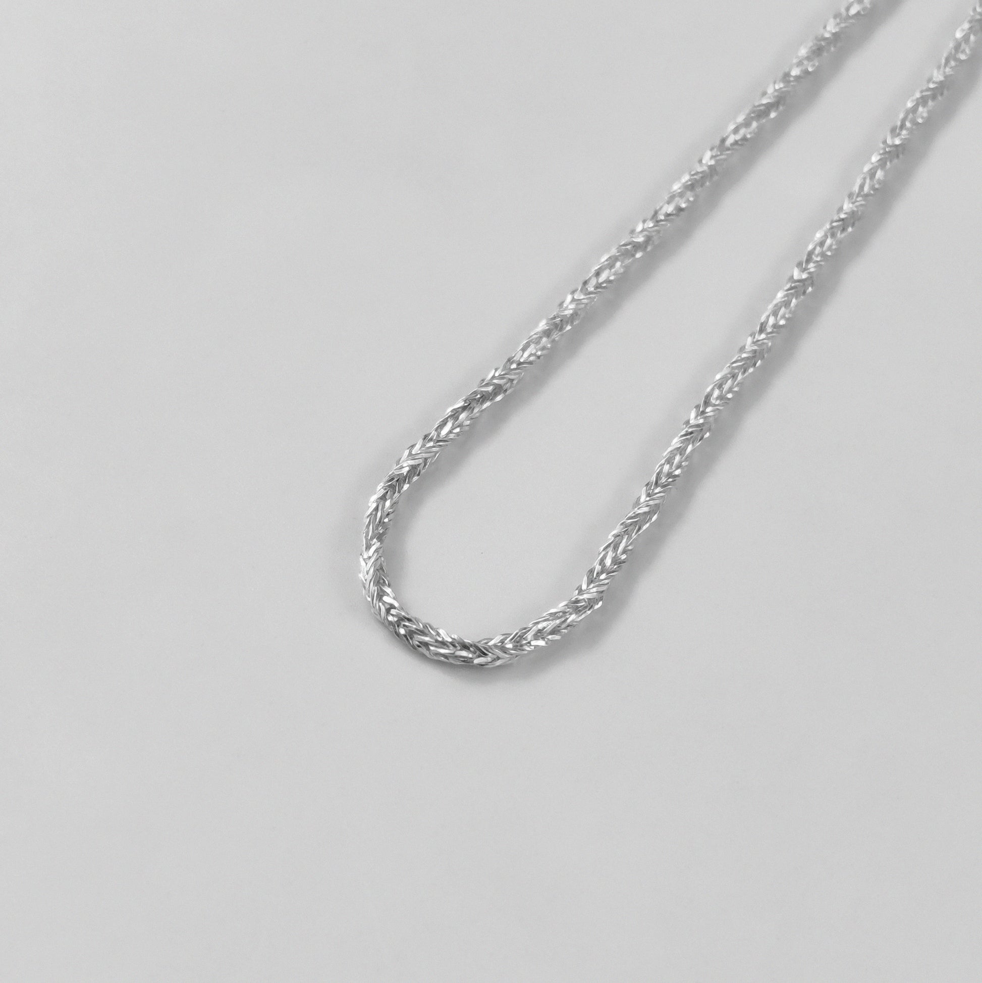 Starlit Weave Necklace - An elegant 925 sterling silver necklace by GetTheJuice, showcasing a delicate starlit weave pattern that brings a celestial charm to your ensemble.