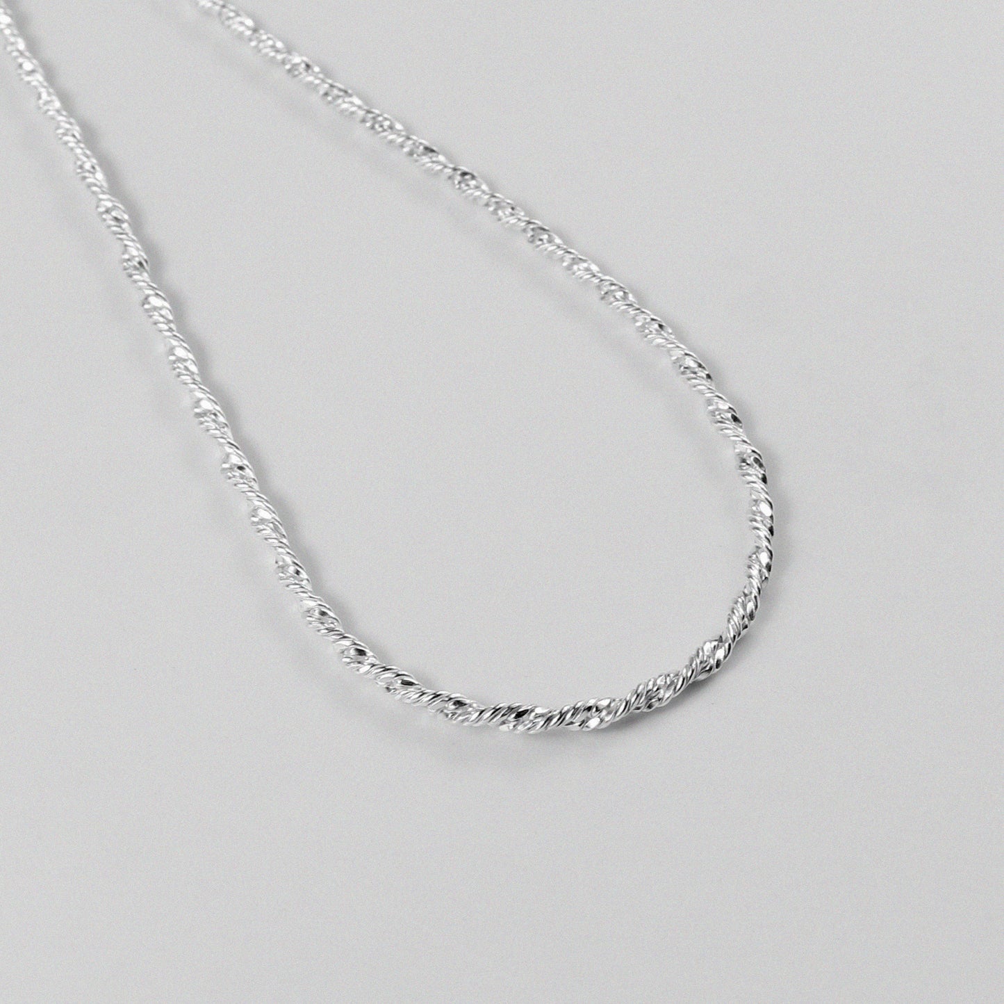 Twisted Rope Necklace - A beautifully crafted 925 sterling silver necklace by GetTheJuice, with a unique twisted rope design that exudes both modernity and tradition.