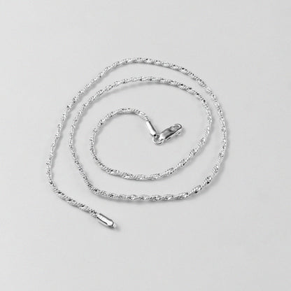 Twisted Rope Necklace - A beautifully crafted 925 sterling silver necklace by GetTheJuice, with a unique twisted rope design that exudes both modernity and tradition.