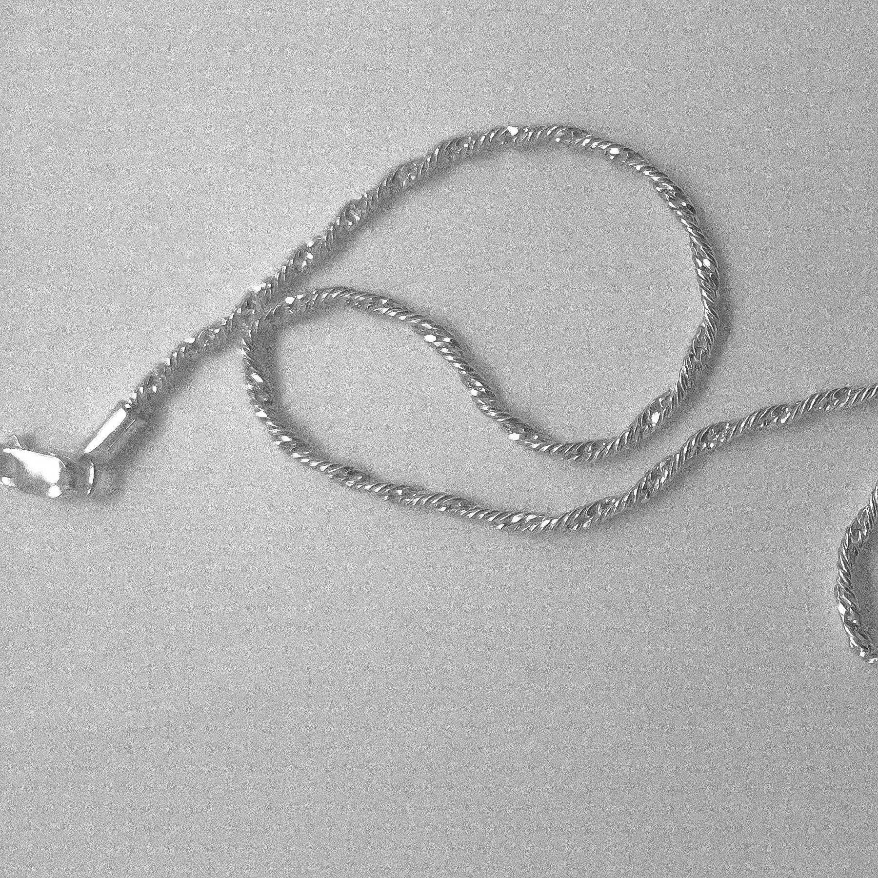 Twisted Rope Necklace - A beautifully crafted 925 sterling silver necklace by GetTheJuice, with a unique twisted rope design that exudes both modernity and tradition.