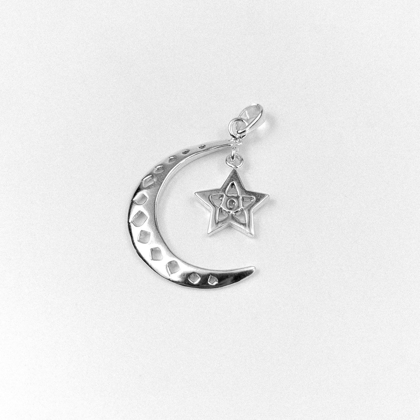 Celestial Charm Pendant - An elegant 925 sterling silver pendant by GetTheJuice, featuring a dazzling celestial design that adds a touch of otherworldly beauty and charm to any look.