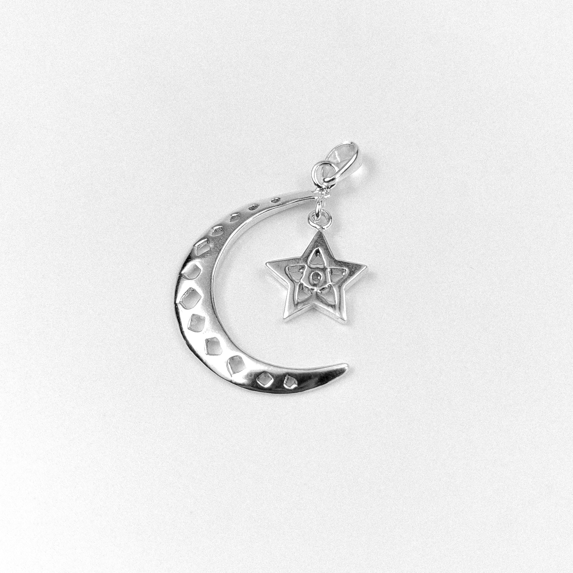 Celestial Charm Pendant - An elegant 925 sterling silver pendant by GetTheJuice, featuring a dazzling celestial design that adds a touch of otherworldly beauty and charm to any look.