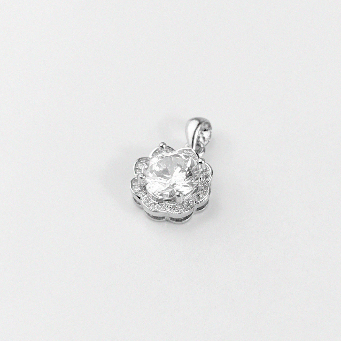 Gemstone Whisper Pendant - A stunning 925 sterling silver pendant by GetTheJuice, showcasing a graceful and understated design embellished with sparkling gemstones, capturing the essence of quiet beauty.