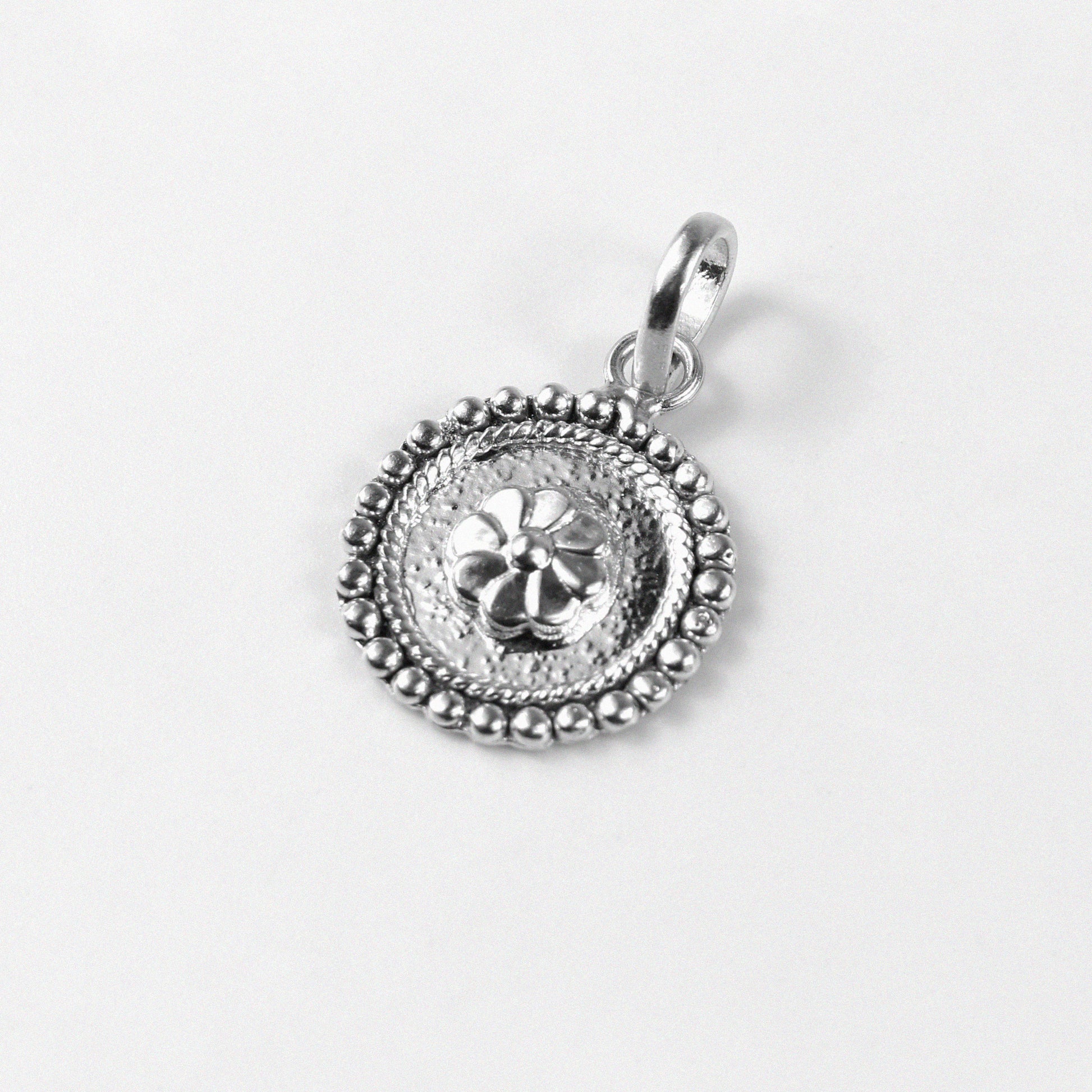 Floral Wheel Pendant - An elegant 925 sterling silver pendant by GetTheJuice, featuring a beautifully crafted floral wheel design that adds a touch of natural grace and charm to any look.