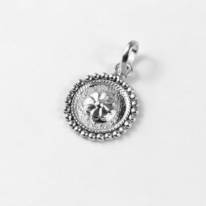 Floral Wheel Pendant - An elegant 925 sterling silver pendant by GetTheJuice, featuring a beautifully crafted floral wheel design that adds a touch of natural grace and charm to any look.