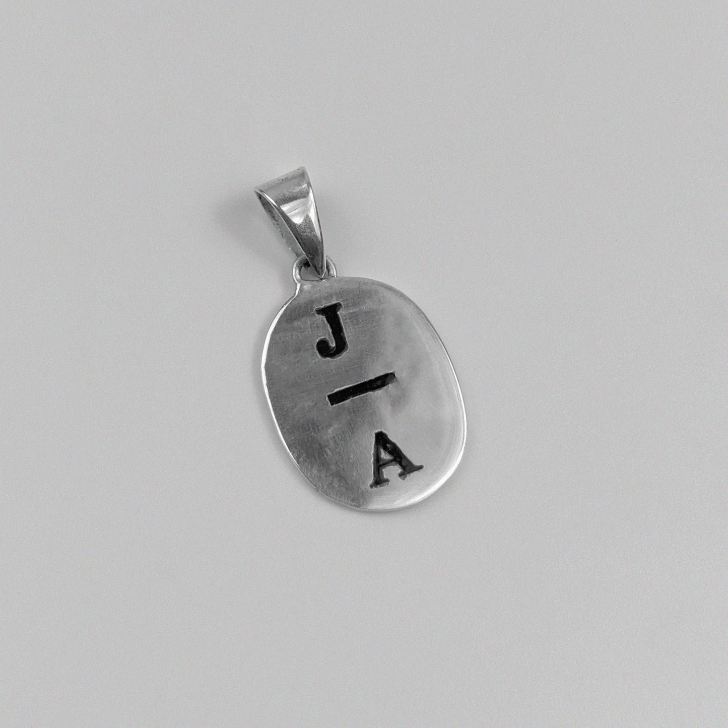 Initial Pendant - A stunning 925 sterling silver pendant by GetTheJuice, with a refined initial design that offers a blend of personalization and timeless elegance.