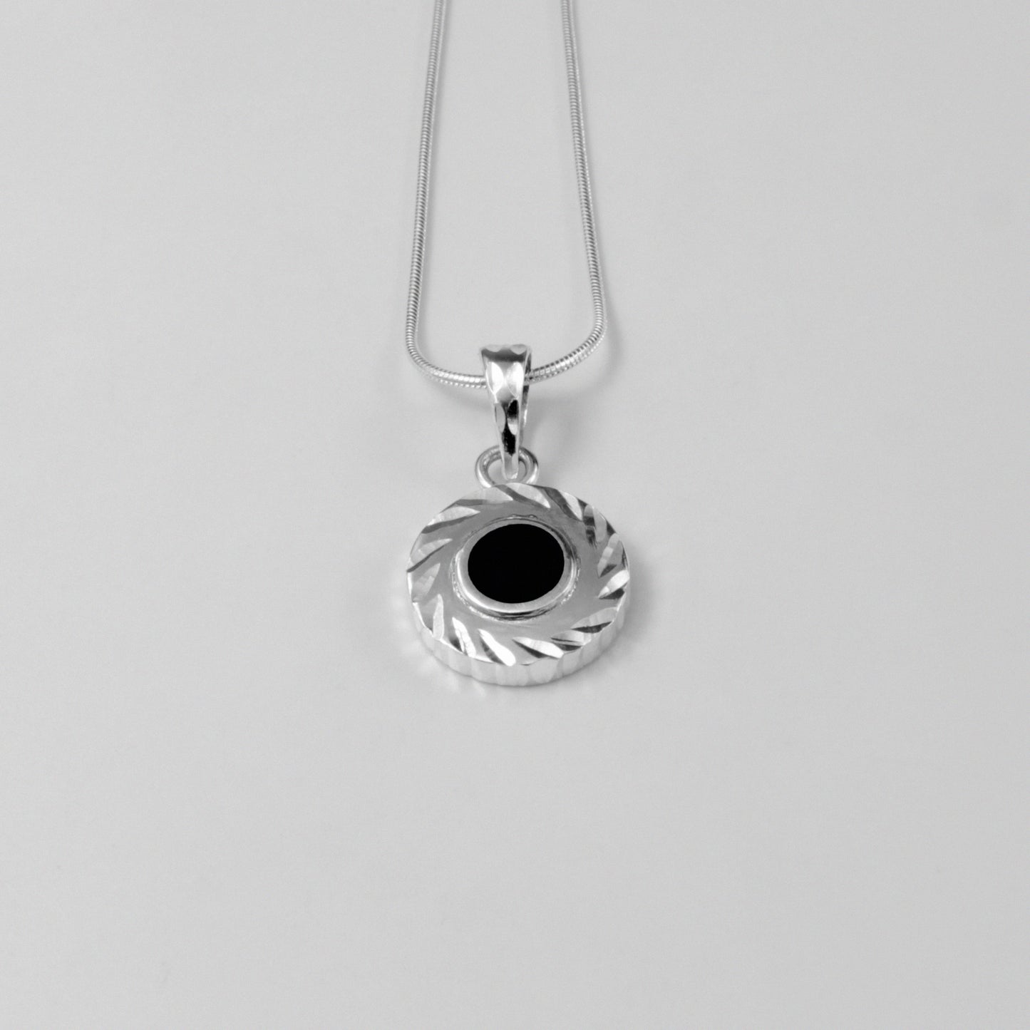 Midnight Eclipse Pendant - A stunning 925 sterling silver pendant by GetTheJuice, showcasing an intricate midnight eclipse motif that blends elegance with celestial allure.